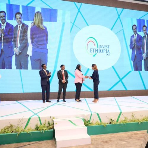 A recognition award is being delivered to the official Travel partner of Invest Ethiopia 2023.-Ethiopian investment